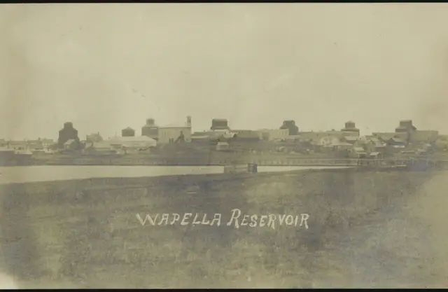 Wapella reservoir with town and grain elevators beyond